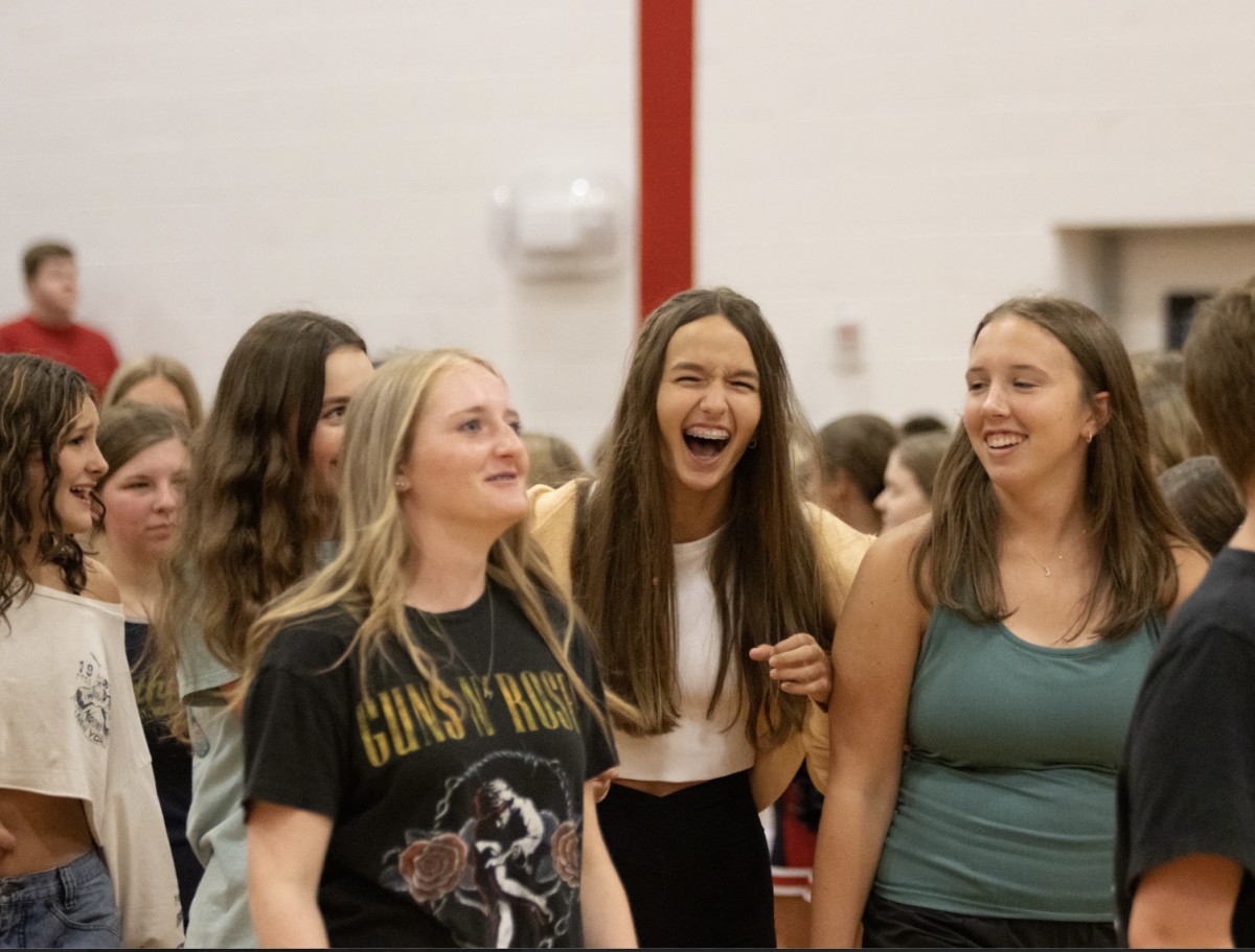 Freshmen enter the assembly after the bridge walk on the first day of school.